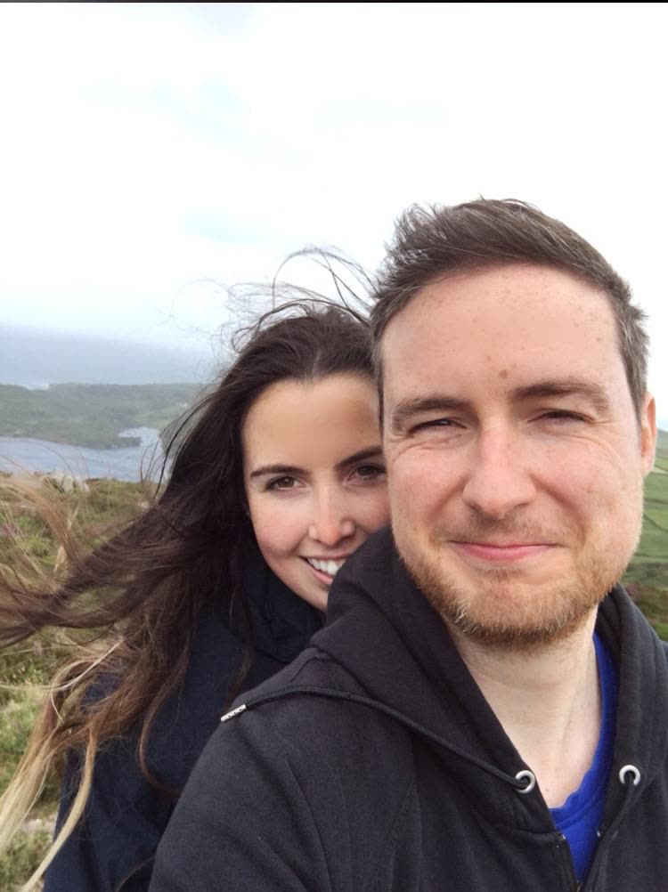 A windswept selfie on the Clare coast, sea and headland behind