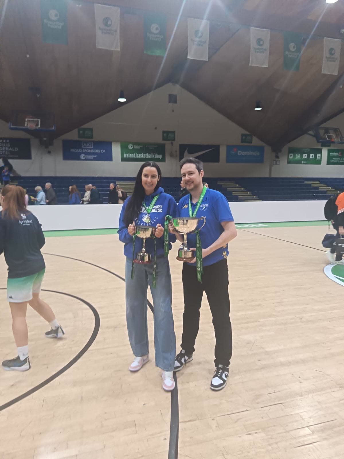 Both on court holding two National Cup trophies