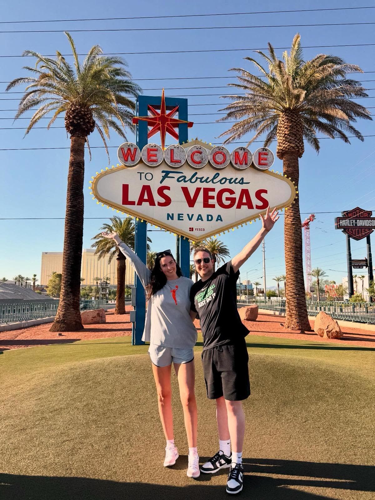 Arms up at the Welcome to Las Vegas sign